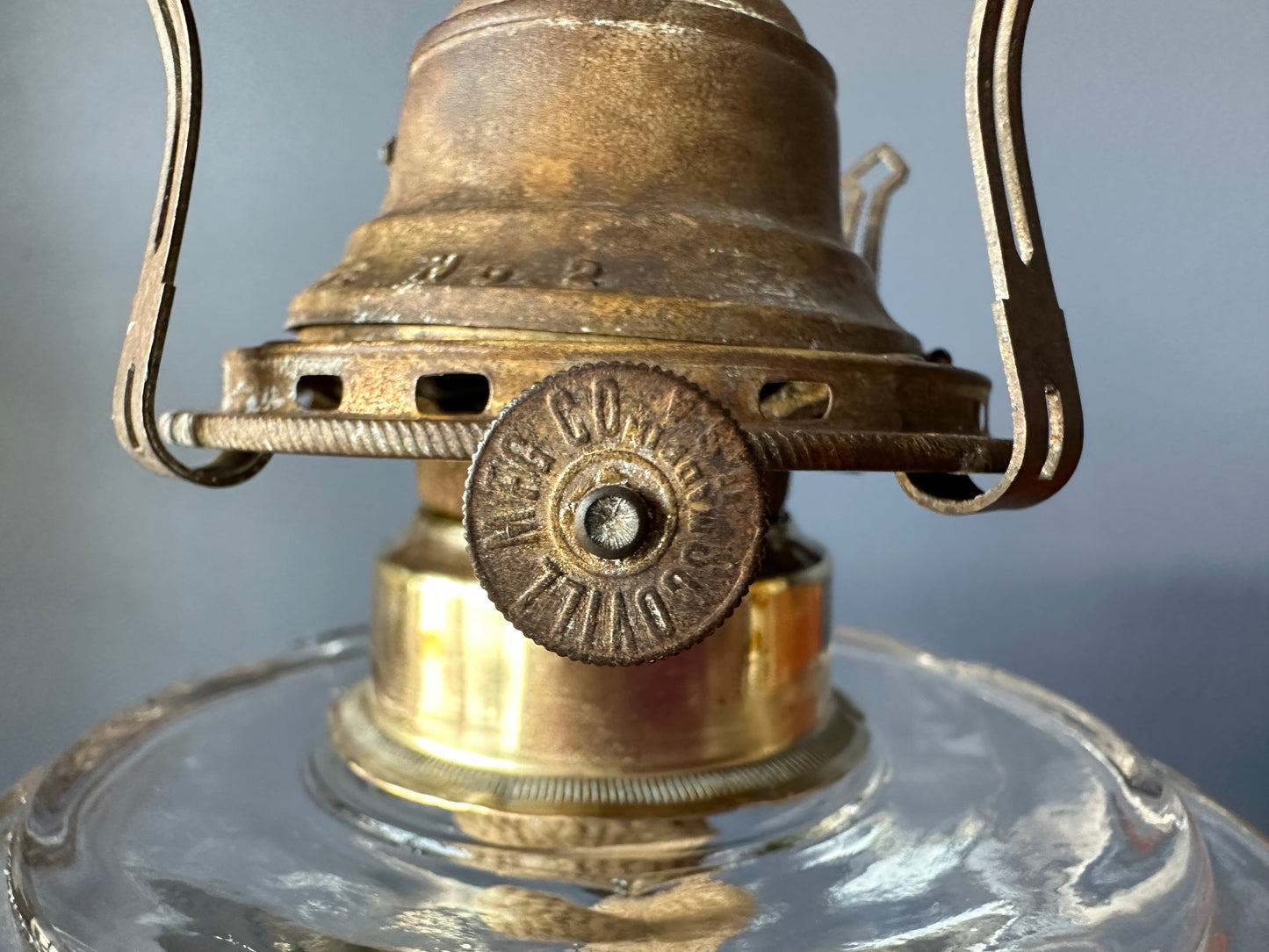 close up of wick winder, Large Pressed Glass Pedestal Oil Lamp