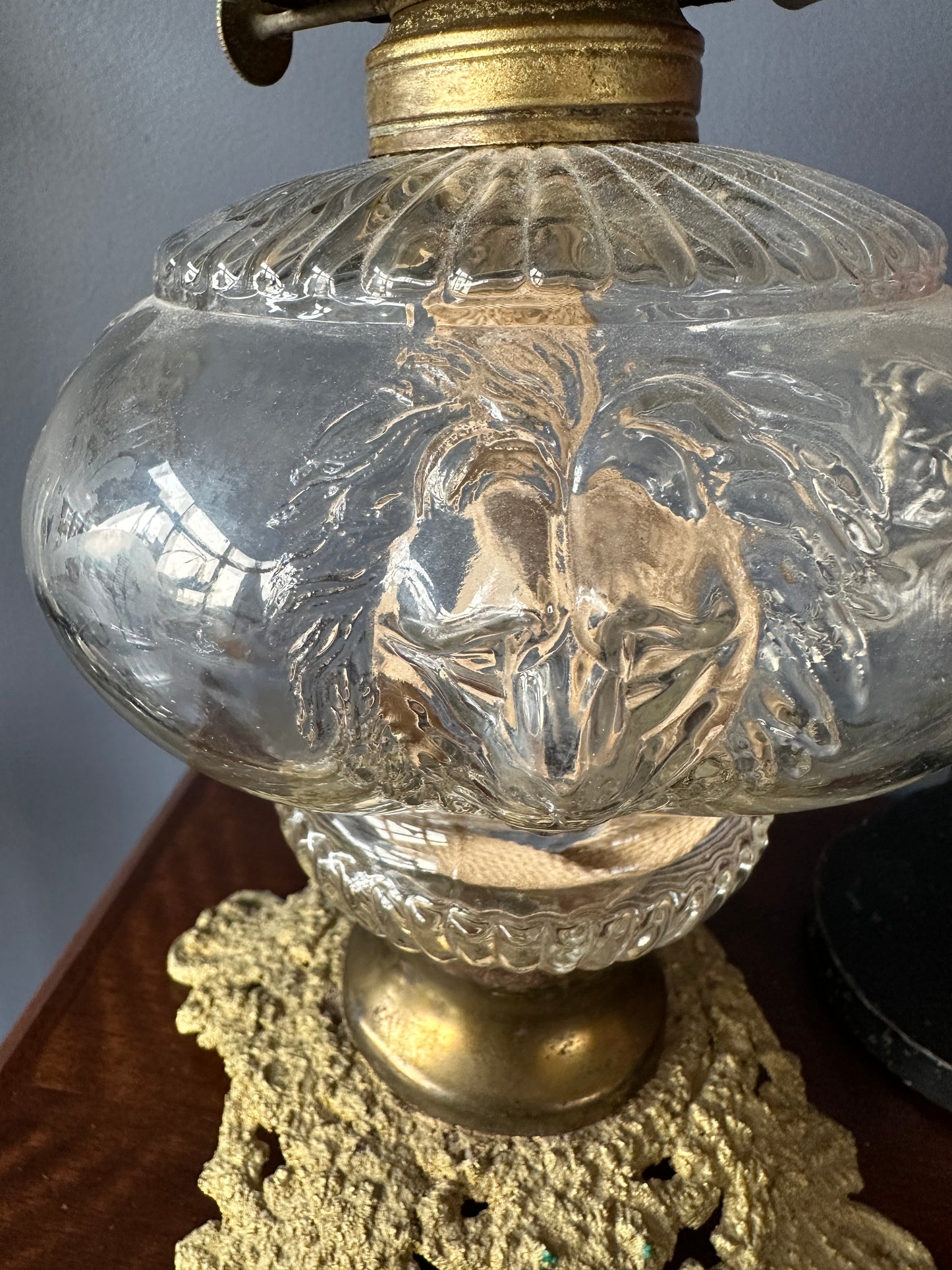 Four Lion Head Glass and Brass Pedestal Oil Lamp, close up of lion head on font