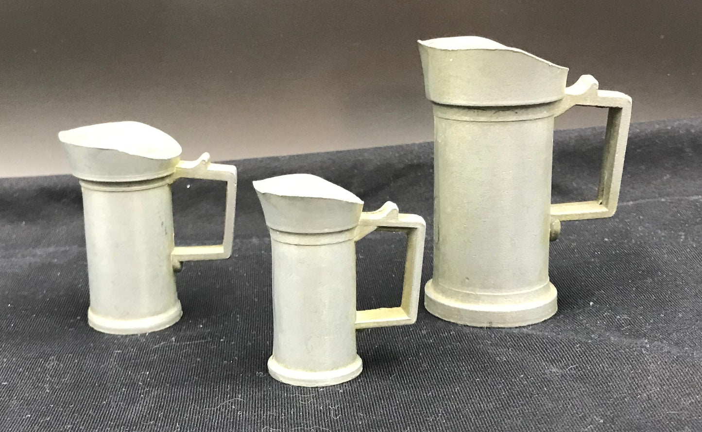 Pewter graduated measuring pitchers - set of 3