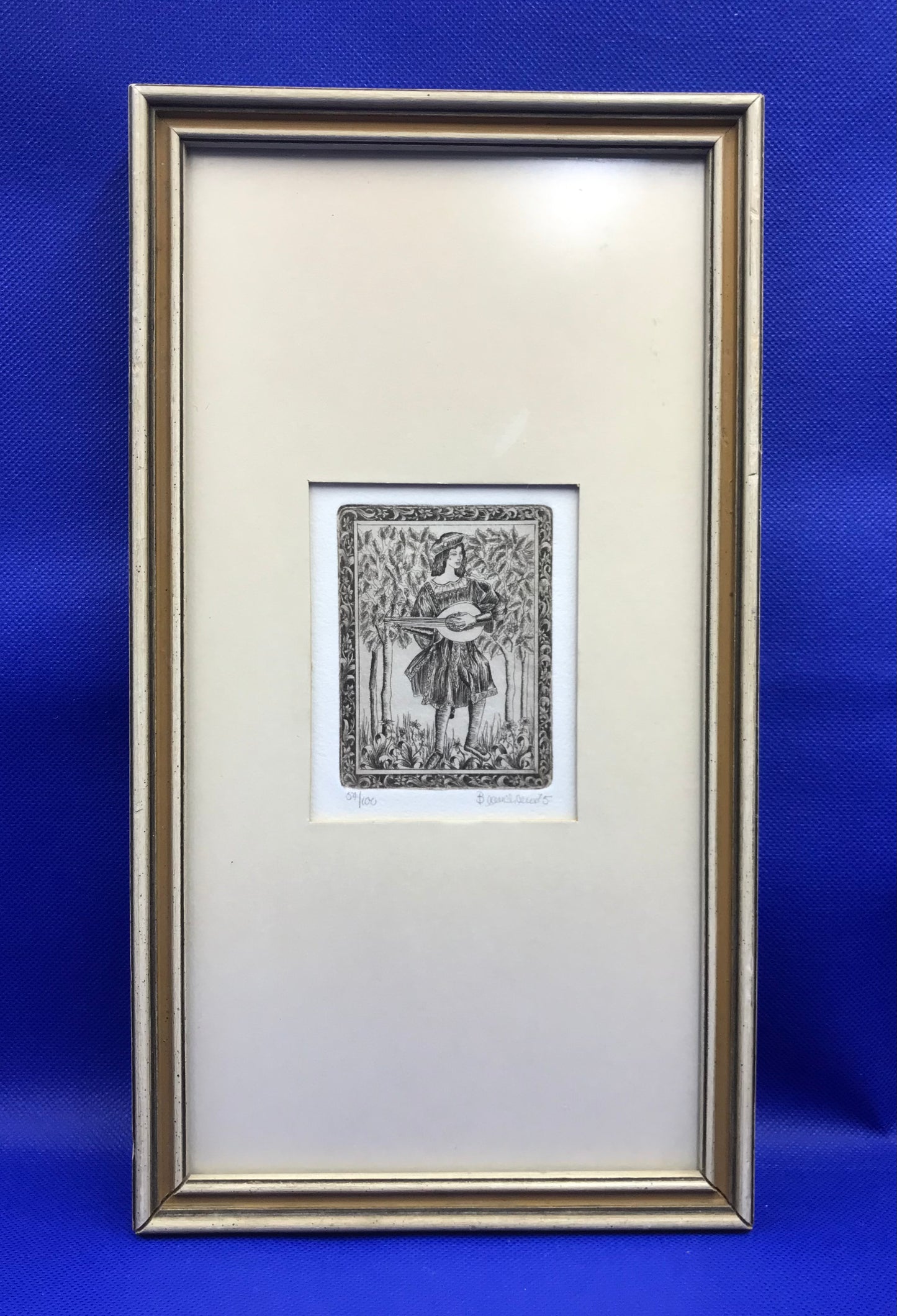 Two limited edition etchings, 1975, young man and woman, playing mandolin and petting a unicorn