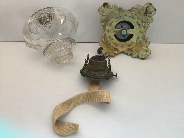Four Lion Head Glass and Brass Pedestal Oil Lamp, disassembled showing underside of base