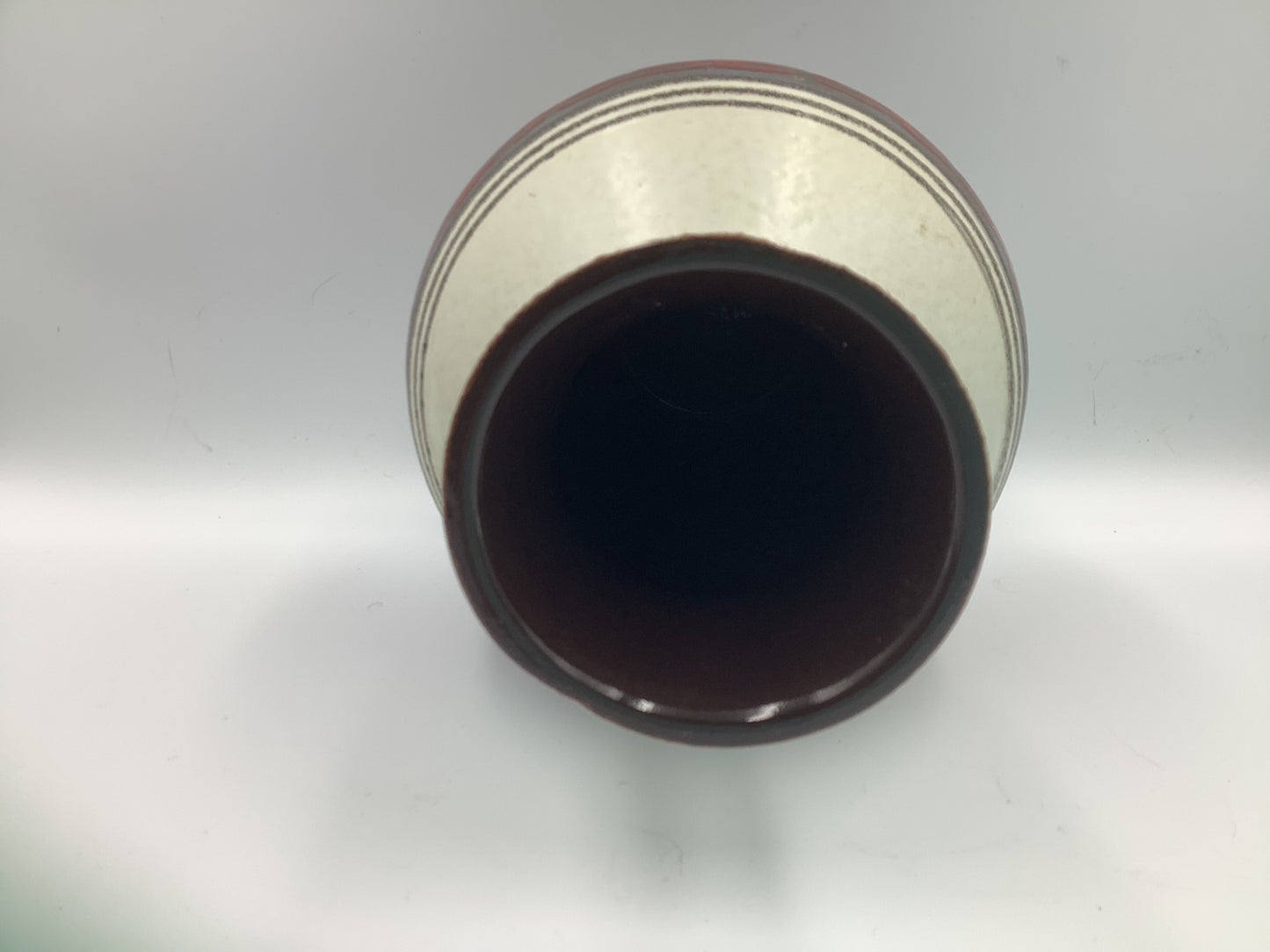 Distinctive vintage Carstens West German vase with a jewel red & charcoal band against a cream background. Marked W Germany 1245-25 S